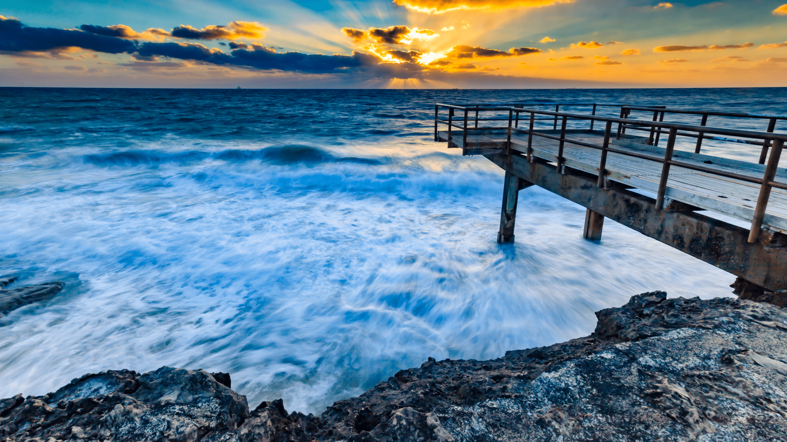 Sunset landscape at the Perth coastline with a wooden jetty